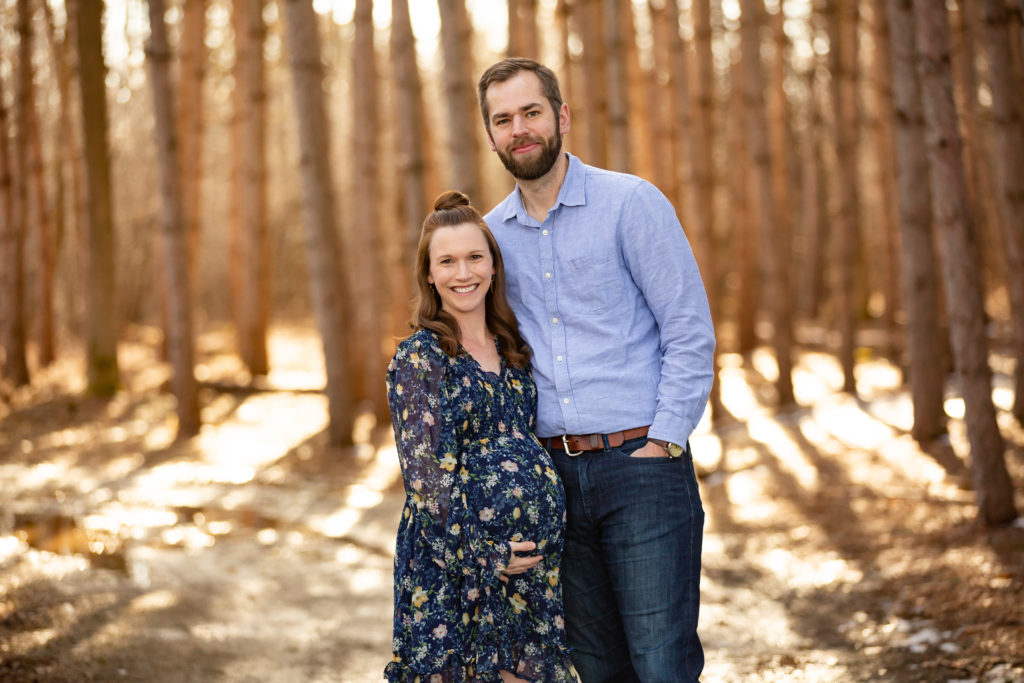 mom and dad smiling maternity photo