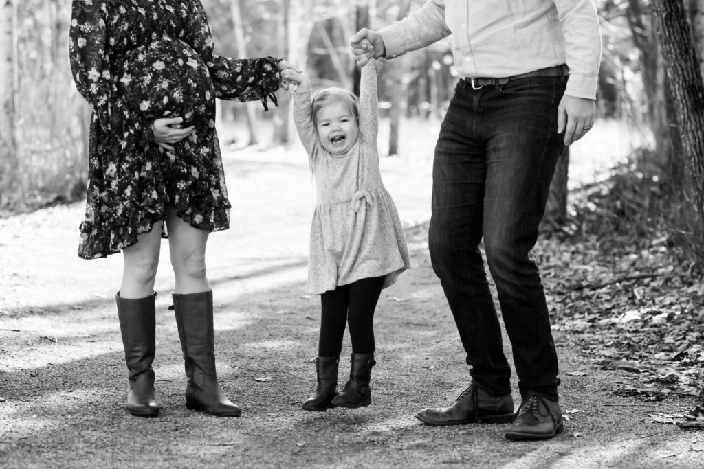 black and white maternity photo toddler between mom and dad 