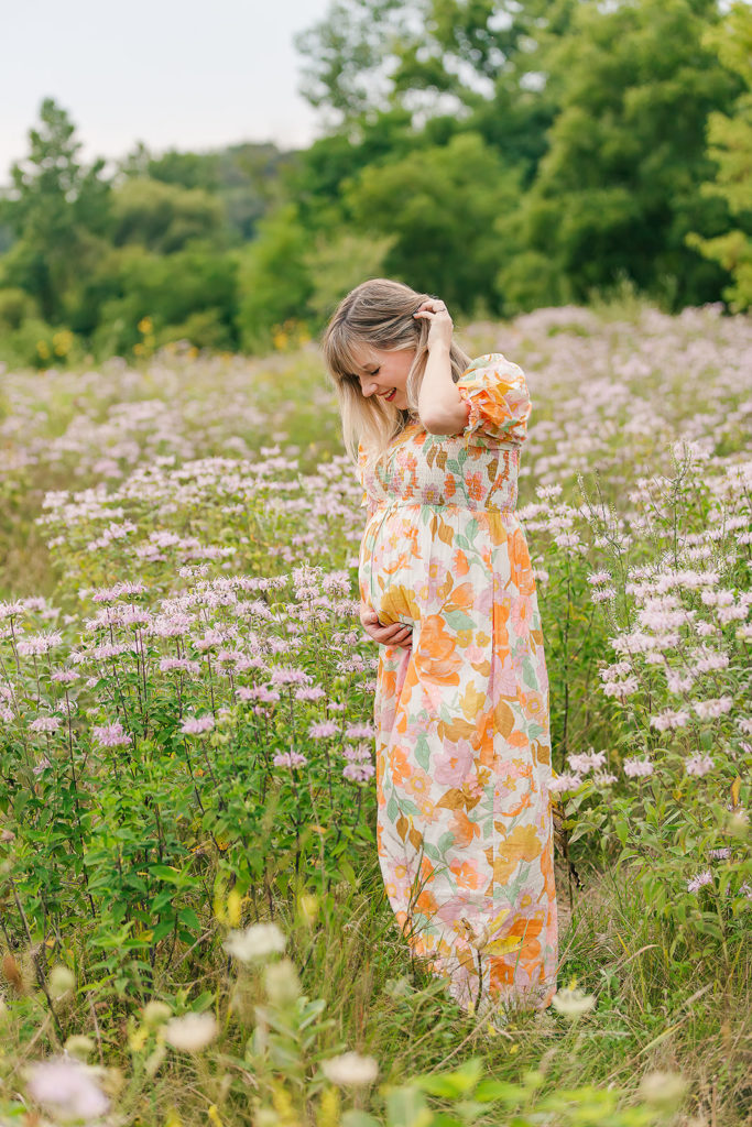 Maternity photo in field flower dress