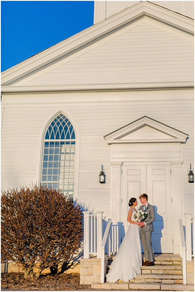 bride and groom moravian chapel at heritage hill in green bay 