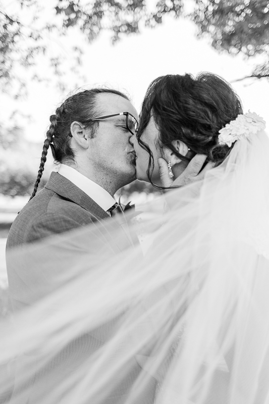 black and white veil shot bride and groom 